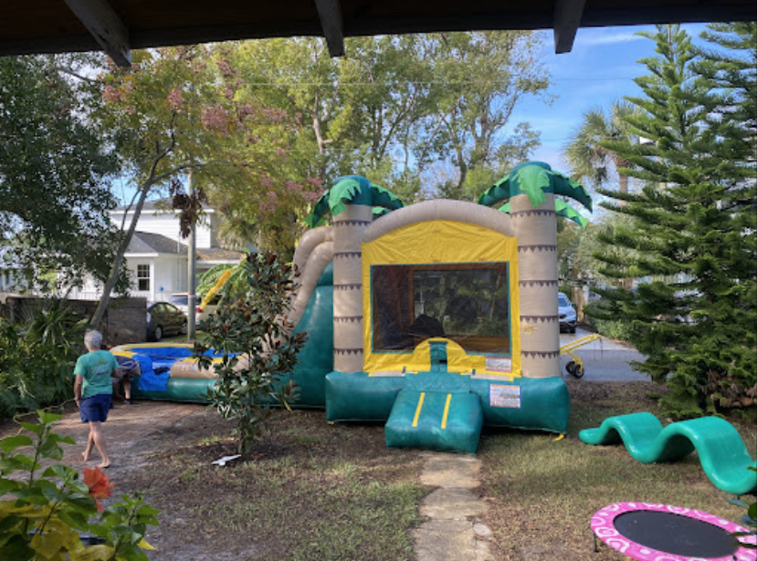 dani testimonial bounce house with slide and pool setup in their back yard